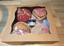 Load image into Gallery viewer, The Gift Box Valentines Day Mini Sourdoughs includes four mini sourdoughs—pumpkin, heart, and two rounds—with St. Dalfour strawberry jam, all arranged in a clear-window box.
